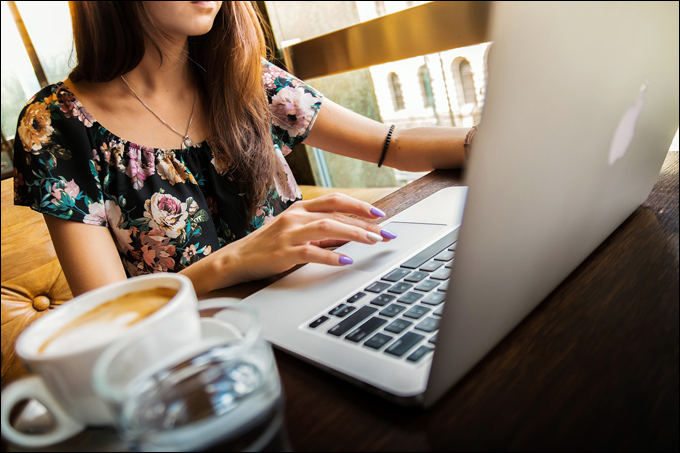 Image of woman working on a laptop.